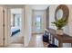 Welcoming foyer with view of the bedroom, front door, and decorative console table at 7077 Painted Bunting Way, St Cloud, FL 34773