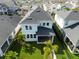Aerial view of home with a well-maintained lawn, tropical plants, and fencing, perfect for outdoor living at 8852 Sperry St, Orlando, FL 32827