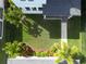 Aerial view of a backyard with manicured lawn and tropical landscaping, offering a private outdoor space at 8852 Sperry St, Orlando, FL 32827
