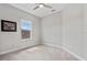 Bright bedroom with plush carpeting and a window with a view of the neighborhood at 8852 Sperry St, Orlando, FL 32827