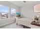 Cozy bedroom with large windows, soft carpet, and pleasant natural light at 8852 Sperry St, Orlando, FL 32827