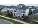 Charming two-story home with stone pillars and a second-story balcony, nestled in a well-manicured lawn at 8852 Sperry St, Orlando, FL 32827