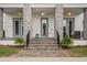 Inviting front porch with stone pillars, ceiling fans, and an elegant entrance at 8852 Sperry St, Orlando, FL 32827