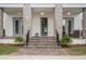 Inviting front porch featuring stone pillars, tiled stairs, and an elegant entrance at 8852 Sperry St, Orlando, FL 32827
