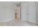 Hallway features gray walls, carpeted floor, and archway to the kitchen at 8852 Sperry St, Orlando, FL 32827