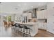 Open kitchen with large central island, bar seating, and pendant lighting at 8852 Sperry St, Orlando, FL 32827