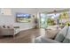 Light-filled living room with sliding glass doors opening to a beautiful backyard patio at 8852 Sperry St, Orlando, FL 32827