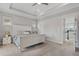 Relaxing main bedroom with soft lighting, neutral carpet, and a view of the ensuite at 8852 Sperry St, Orlando, FL 32827