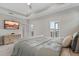 Bright main bedroom featuring a balcony, neutral carpeting, and a ceiling fan at 8852 Sperry St, Orlando, FL 32827