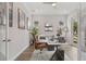 Bright home office features wood floors, a modern desk, and exterior views at 8852 Sperry St, Orlando, FL 32827