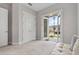 Inviting office space features a bench seat and french doors to the exterior at 8852 Sperry St, Orlando, FL 32827