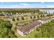 An aerial view of townhomes in a community with mature landscaping and street parking available at 10608 Savannah Plantation Ct, Orlando, FL 32832