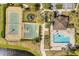 Aerial shot of the community pool, playground, basketball court and tennis courts by the lake at 10608 Savannah Plantation Ct, Orlando, FL 32832