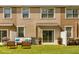 Inviting backyard patio with comfortable seating and lush lawn at 10608 Savannah Plantation Ct, Orlando, FL 32832