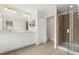 Spacious bathroom featuring double sinks, walk-in shower and tiled floors at 10608 Savannah Plantation Ct, Orlando, FL 32832