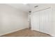 This bedroom features wood-look flooring, neutral paint, ceiling fan, and walk-in closet at 10608 Savannah Plantation Ct, Orlando, FL 32832