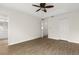 Bright bedroom with tray ceiling, ceiling fan, wood-look flooring, and walk-in closet at 10608 Savannah Plantation Ct, Orlando, FL 32832