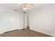 This bedroom features a ceiling fan, wood-look flooring, walk-in closet and neutral paint at 10608 Savannah Plantation Ct, Orlando, FL 32832