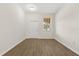 A clean, empty room with a neutral palette, window, and modern flooring at 10608 Savannah Plantation Ct, Orlando, FL 32832
