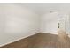 A clean, empty room with a neutral color palette and modern flooring at 10608 Savannah Plantation Ct, Orlando, FL 32832