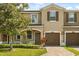 Charming townhome featuring a well-manicured lawn and a two-car garage, perfect for comfortable living at 10608 Savannah Plantation Ct, Orlando, FL 32832