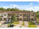 Townhomes featuring manicured lawns and garages at 10608 Savannah Plantation Ct, Orlando, FL 32832