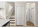 Hallway and staircase with wood flooring and bi-fold closet door at 10608 Savannah Plantation Ct, Orlando, FL 32832