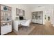 Bright home office features a modern desk, shelving, and natural light at 10608 Savannah Plantation Ct, Orlando, FL 32832