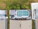 Aerial view of the private screened-in pool and outdoor living spaces at 130 Bloomingdale Dr, Davenport, FL 33897