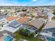 Aerial view of the neighborhood featuring several houses with screened-in pools at 130 Bloomingdale Dr, Davenport, FL 33897