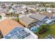 Aerial view of homes with screened-in pools in a beautiful community at 130 Bloomingdale Dr, Davenport, FL 33897