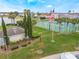 Beautiful community amenities featuring a basketball court, green spaces, and a view of the lake at 130 Bloomingdale Dr, Davenport, FL 33897