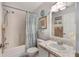 Charming bathroom featuring a shower-tub combo and bright accents at 130 Bloomingdale Dr, Davenport, FL 33897