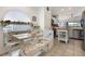 Cozy breakfast nook adjacent to the kitchen with a corner booth at 130 Bloomingdale Dr, Davenport, FL 33897