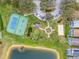 Aerial view showcasing tennis and basketball courts, a charming gazebo, and a sandy volleyball court at 130 Bloomingdale Dr, Davenport, FL 33897