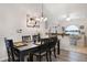 Elegant dining room with a modern chandelier and stylish decor at 130 Bloomingdale Dr, Davenport, FL 33897