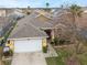 Charming single-story home with a well-manicured front yard, attached garage, and inviting curb appeal at 130 Bloomingdale Dr, Davenport, FL 33897