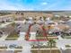 Charming single-Gathering home with a well-maintained lawn and a two-car garage in a residential neighborhood at 130 Bloomingdale Dr, Davenport, FL 33897