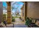Welcoming front porch featuring seating and decorative plants, with a view of the street at 130 Bloomingdale Dr, Davenport, FL 33897