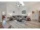 Spacious living room with vaulted ceiling, skylight, and comfortable seating at 130 Bloomingdale Dr, Davenport, FL 33897
