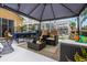 Inviting covered patio with comfortable seating, a dining area, and tasteful decor at 130 Bloomingdale Dr, Davenport, FL 33897