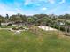 Well-maintained sand volleyball court with manicured landscaping and walking paths in a vibrant community at 130 Bloomingdale Dr, Davenport, FL 33897