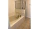Bathroom features a soaking tub with shower, tile flooring, and a glass-enclosed shower at 1309 Heritage Commons Dr, Winter Springs, FL 32708