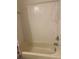 Classic bathtub with white tile surround and updated shower fixtures, ready for relaxation at 1309 Heritage Commons Dr, Winter Springs, FL 32708