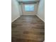 Bedroom with modern flooring and bright natural light coming from the window at 1309 Heritage Commons Dr, Winter Springs, FL 32708
