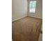 Bedroom with neutral carpeting and natural light from the window, providing a calm atmosphere at 1309 Heritage Commons Dr, Winter Springs, FL 32708