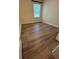 Bedroom with modern flooring and bright natural light from a large window at 1309 Heritage Commons Dr, Winter Springs, FL 32708