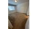 Cozy bedroom with neutral carpeting and a window providing natural light, creating a comfortable space at 1309 Heritage Commons Dr, Winter Springs, FL 32708