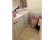 Efficient laundry area featuring modern washer and dryer units with tile flooring at 1309 Heritage Commons Dr, Winter Springs, FL 32708