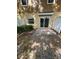 Private patio with brick pavers, enclosed by a white fence, offering an outdoor living space at 1309 Heritage Commons Dr, Winter Springs, FL 32708